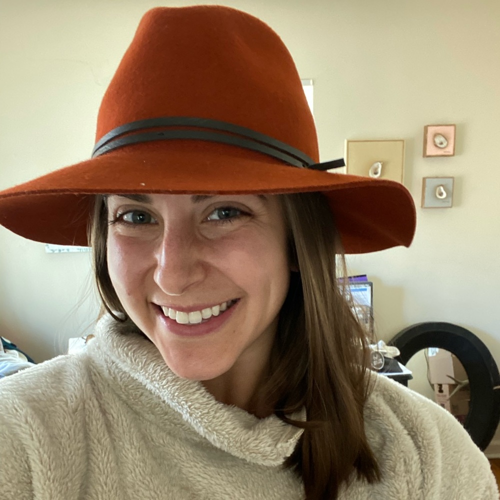 Burnt orange wool hat with black leather tie